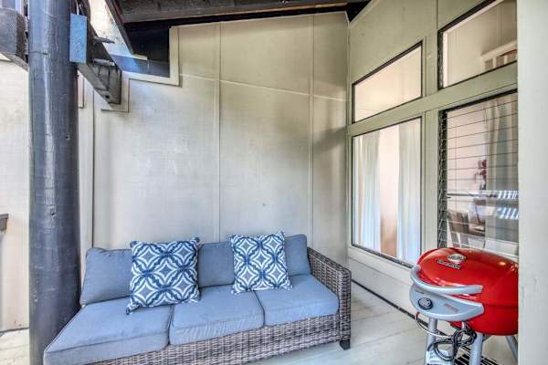 Covered Lanai Nook with Wicker Couch & Portable BBQ Grill