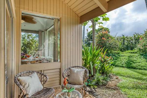 Peaceful lanai overlooking lush tropical gardens