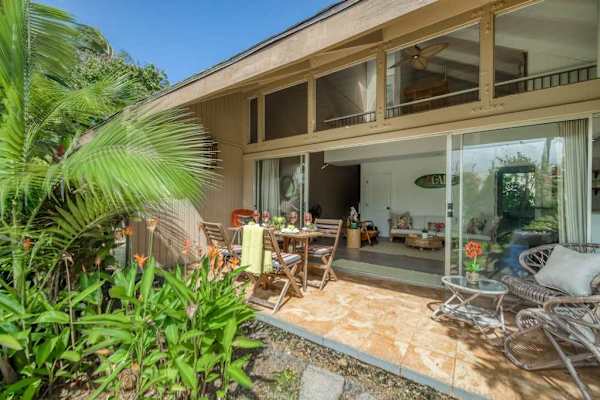 Relax on the covered lanai surrounded by tropical gardens