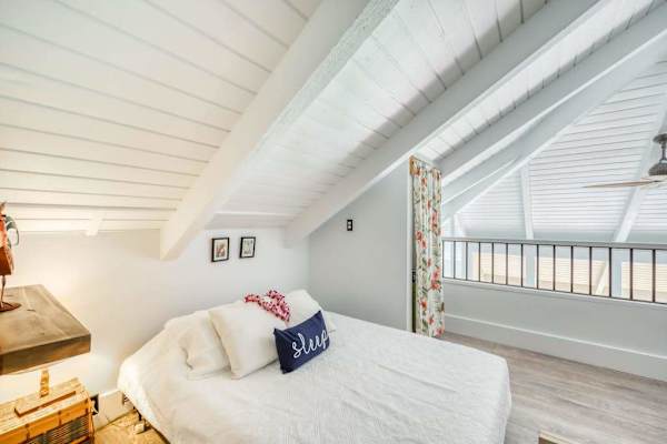 Comfortable loft bedroom with open railing