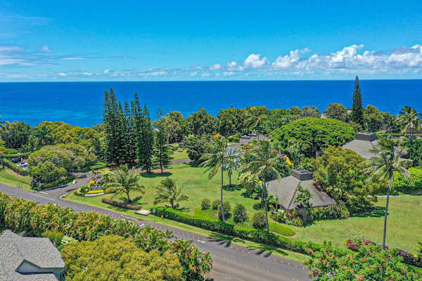 Sweeping aerial view of the tropical resort and Pacific Ocean