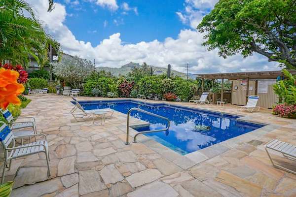Spacious pool deck with lounge seating
