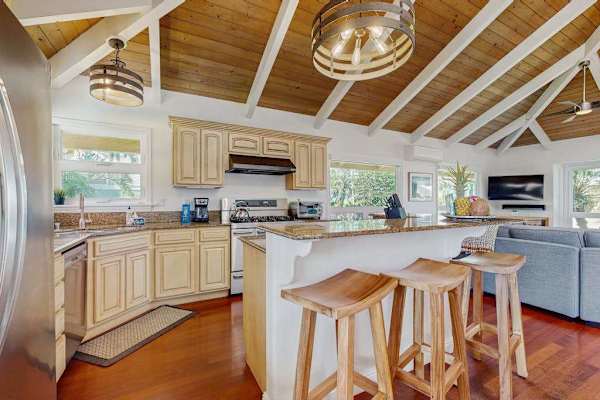 Bright, open floor plan with abundant natural light and extra seating—perfect for your sous chef or gathering with family and friends.