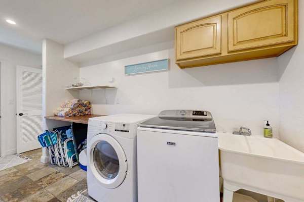 The in-home washer and dryer make family stays easy and convenient along with seven beach chairs, beach towels, water sports gear, and a beach umbrella are available for guest use.
