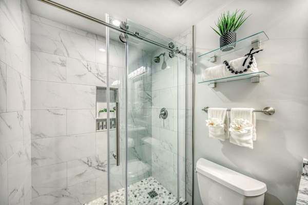 Spacious Walk-In Shower With Marble Details