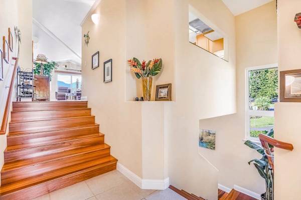 Welcoming Entryway With Open Staircase