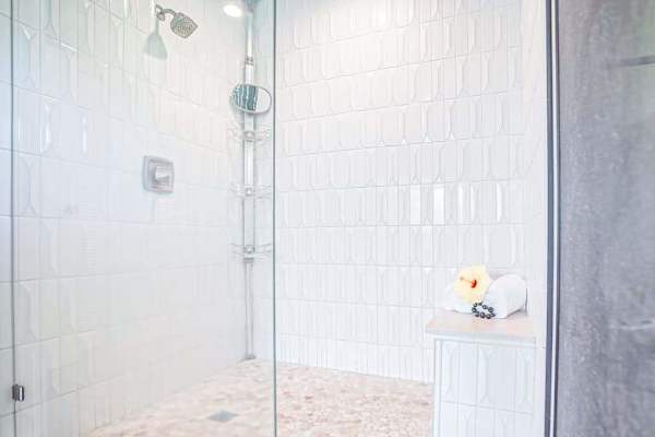 Spa-like primary ensuite bathroom with modern finishes