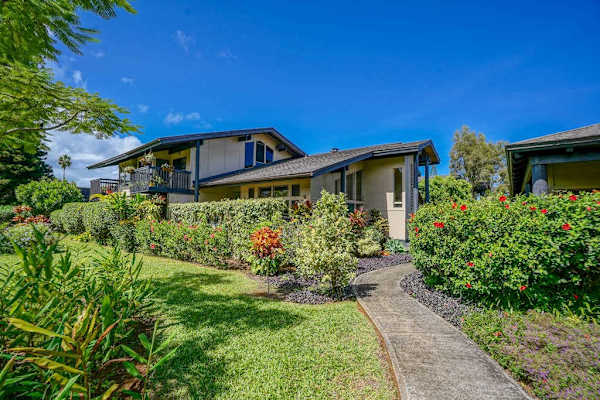 Charming exterior surrounded by tropical gardens