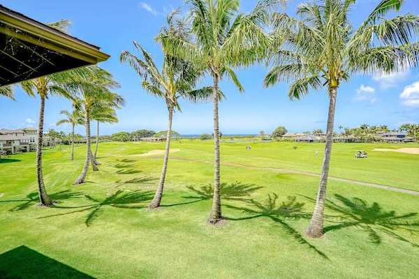 Pili Mai Resort with lush tropical views and swaying palm trees.