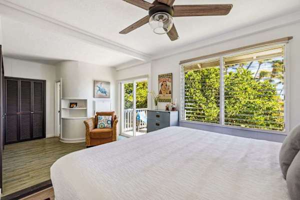 Guest room with king bed, private lanai access and a great area to sit and read a book in the afternoon.
