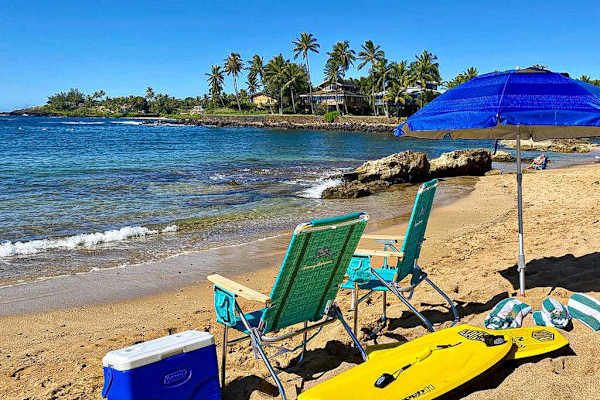 Chairs, umbrella, towels, cooler and boards - ready for our day in the sun.