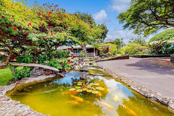 Kiahuna Plantation is a lush tropical oasis with vibrant gardens, swaying palms, and a tranquil koi pond, creating a peaceful island retreat just moments from the beach.
