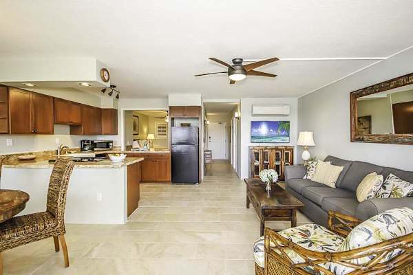 Living room which is open to the dining room and kitchen in this open concept design.