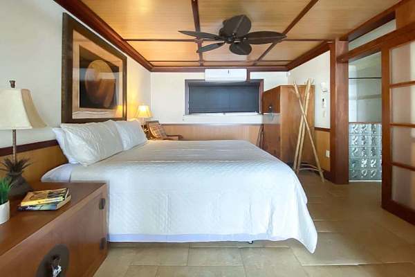 Master bedroom with king bed and a flat screen tv.