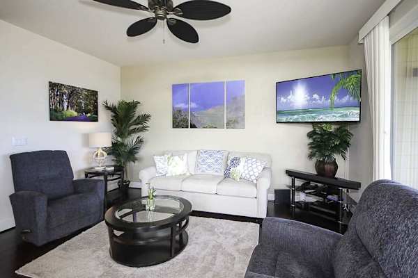 Settle into the bright living room, where you can put your feet up on the couch and two chairs to watch movies on the flatscreen TV. Extra guests? The couch doubles as a queen sleeper sofa. Large picture windows and sliding doors.