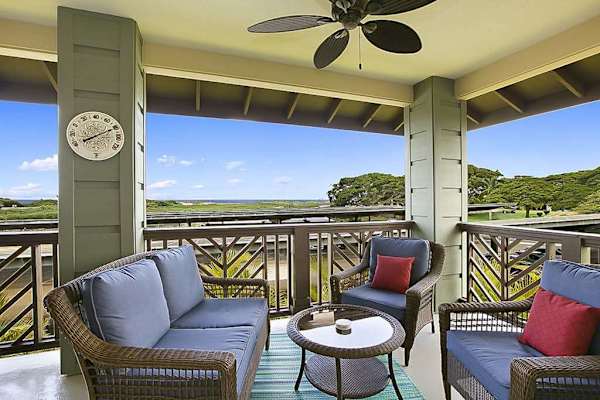 Put an umbrella in your drink and head out to the lanai with distant ocean views. Delve into a good book as the ceiling fan spins lazily above you. A six-person dark wicker patio table begs you to dine al fresco.