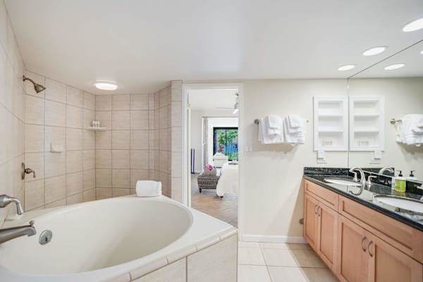 Spacious bathroom with a soaking tub and dual vanity