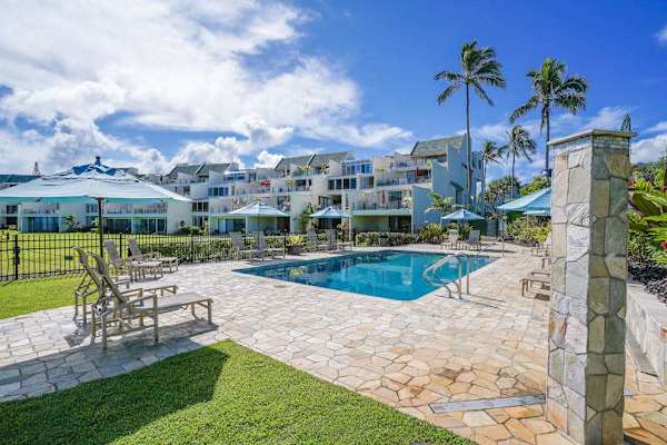Resort-style pool surrounded by tropical beauty
