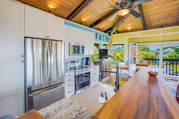 Completely remodeled stainless steel kitchen.   The island is for extra countertop space and barstools for extra seating.