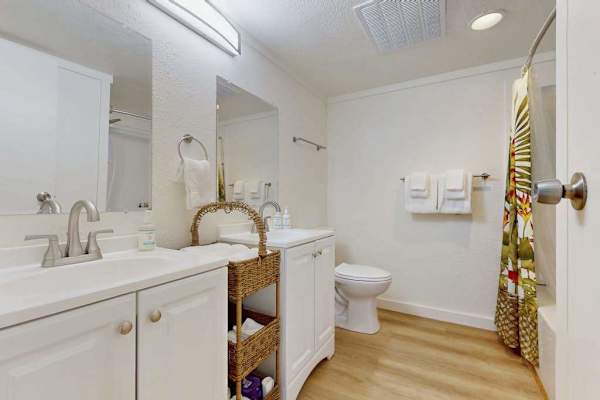 Bright Guest Bathroom Complete With Clean Lines And Plush Towels
