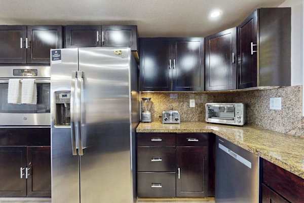 Premium Appliances And Granite Counters For Gourmet Meals