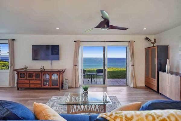 Open living area with tropical décor and natural light