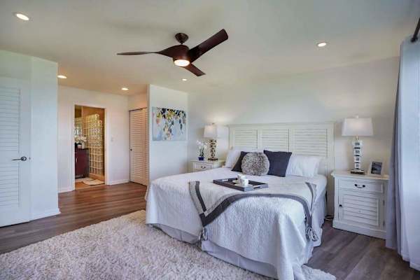 Comfortable bedroom with a ceiling fan and soft natural light
