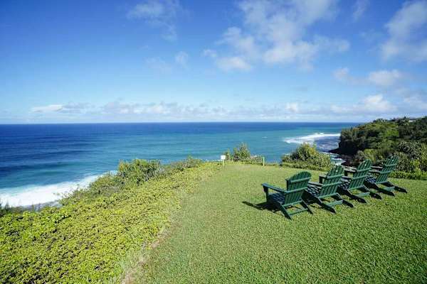 Grassy oceanfront area, perfect for relaxing by the sea