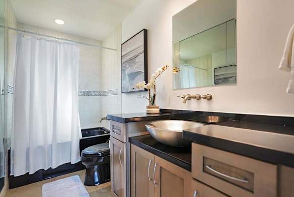 Guest bathroom with a stylish vanity and mirror