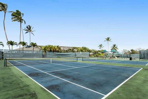 Sunlit Tennis Match Setting