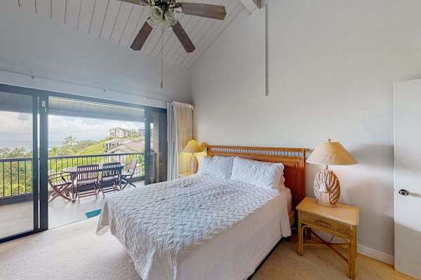 Bedroom retreat features king bed warm accents and gentle daylight