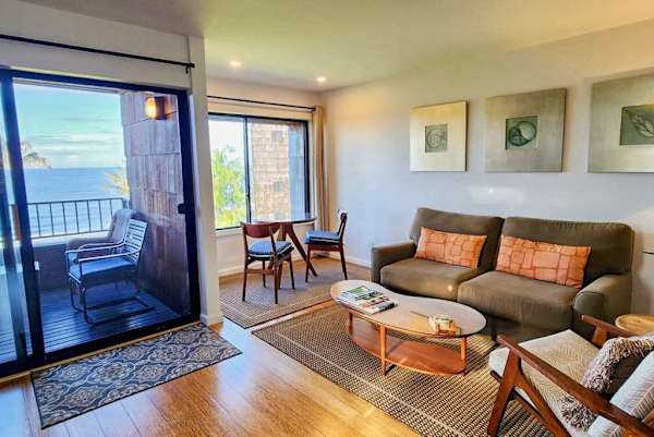 Bright living room opens toward ocean views with inviting seating