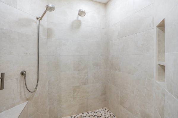 Elegant walk-in shower with modern finishes