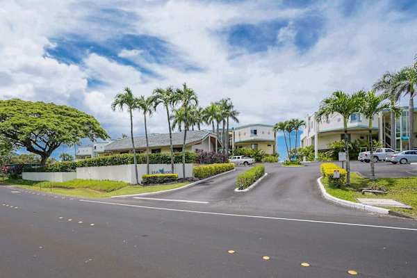 A welcoming entrance surrounded by lush tropical landscaping