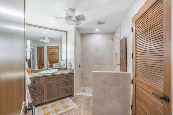 Modern guest bathroom with dual vanities and elegant finishes