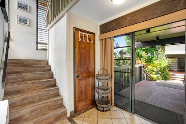 Stairs leading up to the private upper-level loft and additional guest bedrooms.