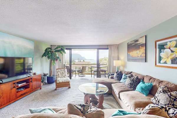Bright lounge blends island decor comfortable seating and balcony views