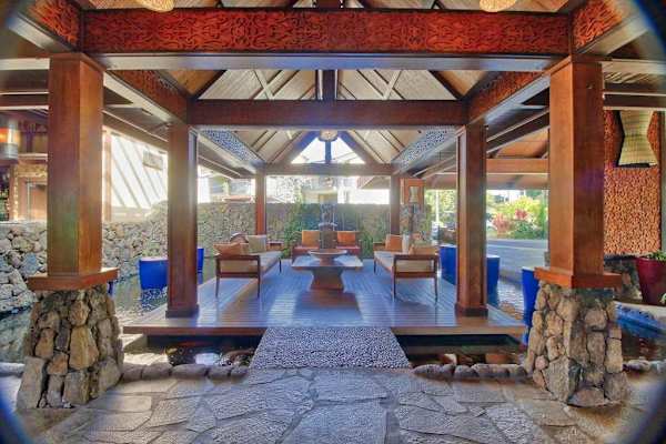 Pavilion offers comfortable seating, natural light, and tropical garden views