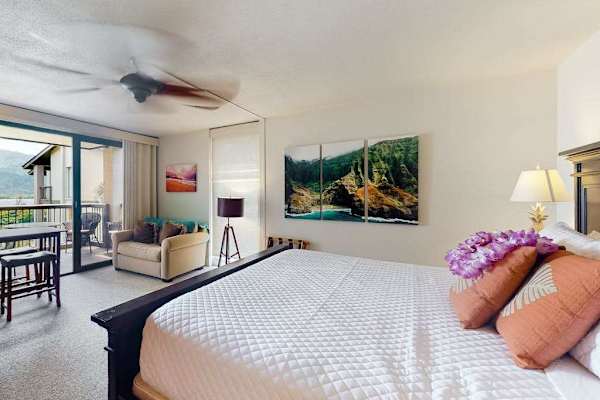 Spacious studio offers comfortable bedding, seating, and refreshing island views