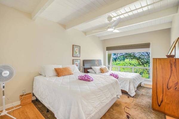 Bright guest bedroom with plenty of natural light.