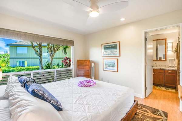 Spacious bathroom with a granite vanity and walk-in shower.