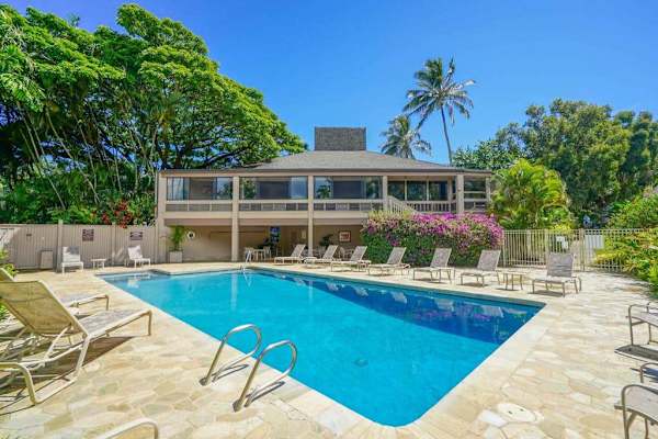 Sunlit pool creates an appealing setting for daytime outdoor relaxation