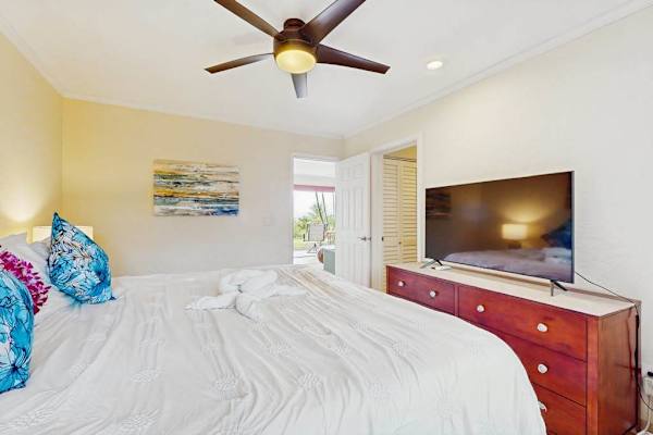 Sunlit sleeping space features coordinated furnishings, calming colors, and comfort
