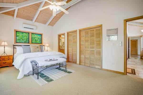 Spacious Primary Bedroom With Vaulted Ceilings