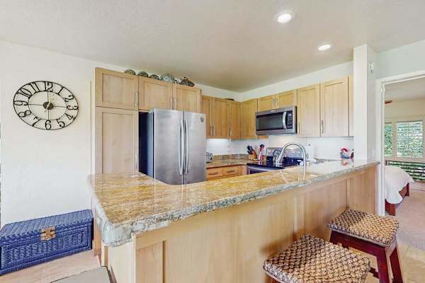Bright cooking space provides organized storage, fixtures, and preparation room