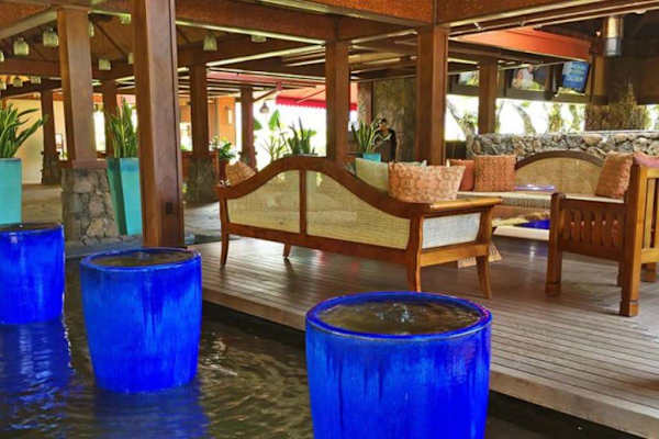 Gather comfortably in this open pavilion surrounded by tropical surroundings