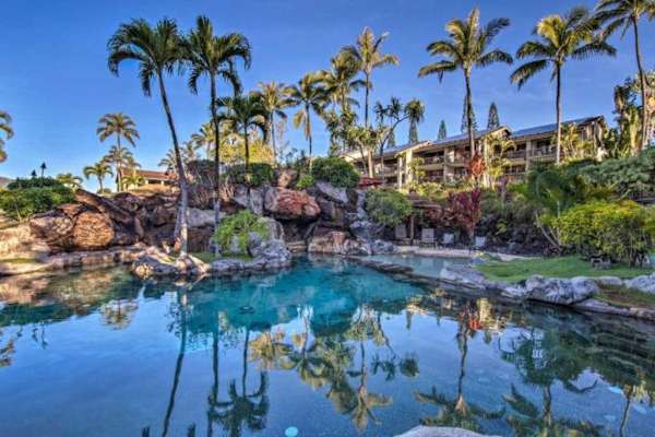 Sparkling resort pool offers a refreshing escape beneath tropical skies