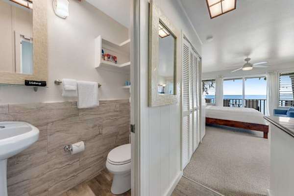 Full bathroom with a walk-in shower and modern finishes.