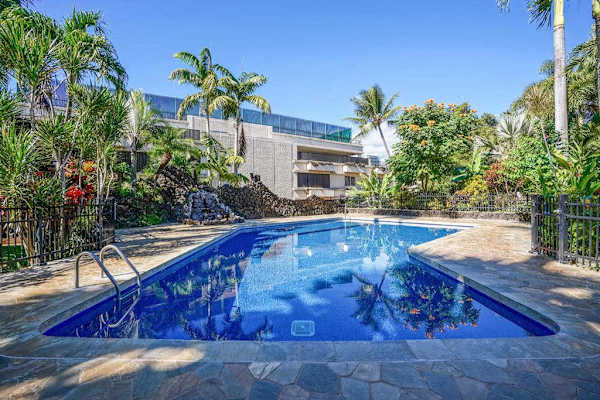 Resort Pool Oasis Beneath Swaying Palms
