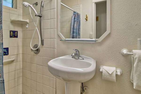 Well-appointed full bathroom with shower and everyday essentials.
